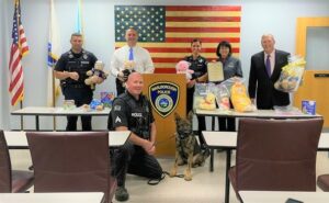  Teddy bears and books, on behalf of the GFWC Marlborough Junior Woman's Club, were recently donated to the Marlborough Police Department to be used on emergency/domestic violence calls involving children. Marlborough City Councilor Katie Robey (a member of the Juniors), was joined in the presentation by Marlborough Mayor Arthur Vigeant, Marlborough Police Chief David Giorgi and members of the Marlborough Police Department