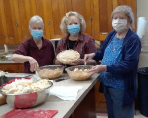  From left, Cindy Vail, Debbie Marino and Joan Beauchemin prepare apple pies for the Meeting House Fair of the Women’s Fellowship of the First Church in Marlborough, Congregational. (Photo/submitted)