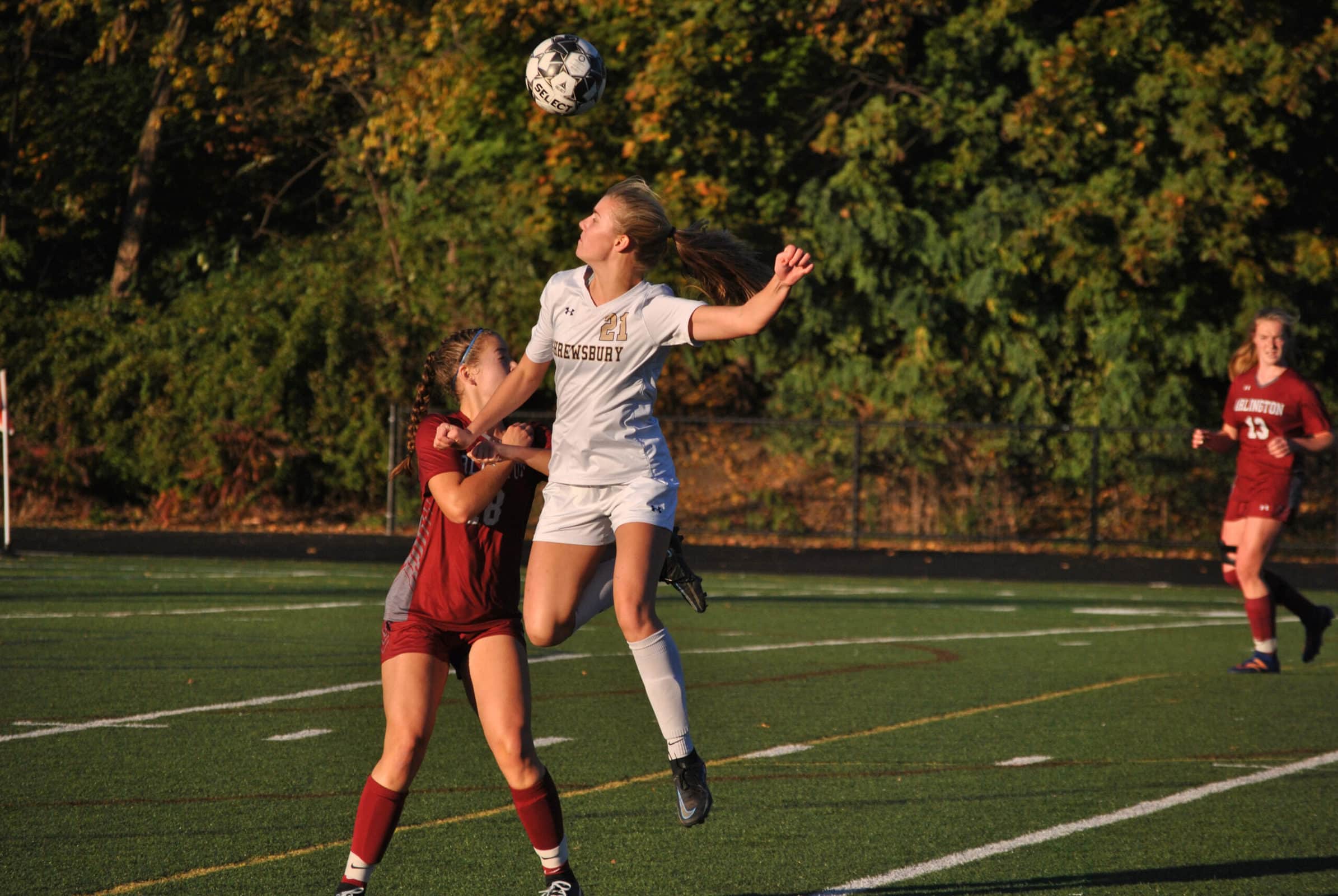 Shrewsbury’s Amanda Kalinowski jumps to head the ball away from an opponent. (Photo/Dakota Antelman)