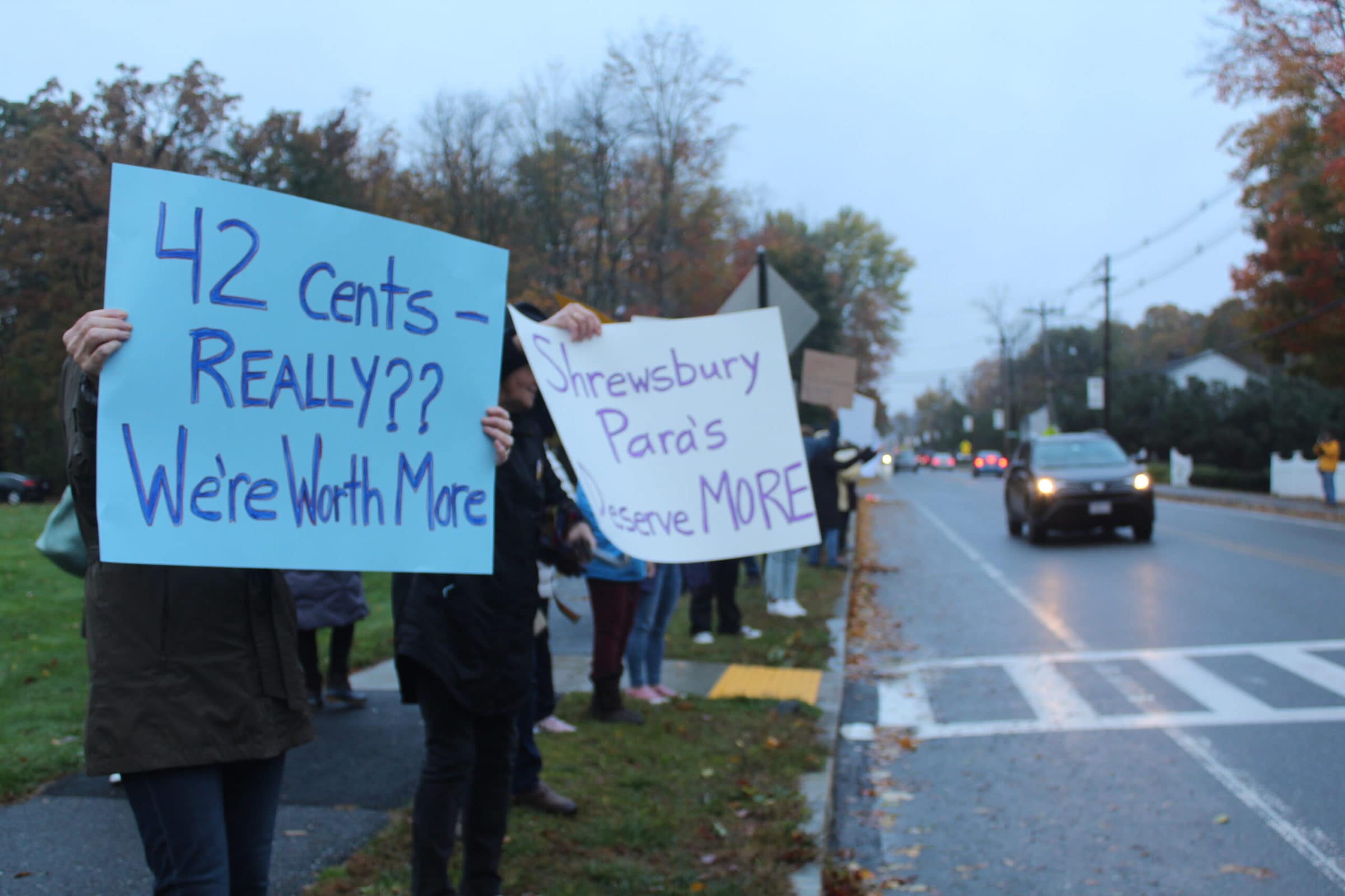 Supporters hold signs along Maple Avenue during a recent rally held by the Shrewsbury Paraprofessionals Association. (Photo/Laura Hayes)