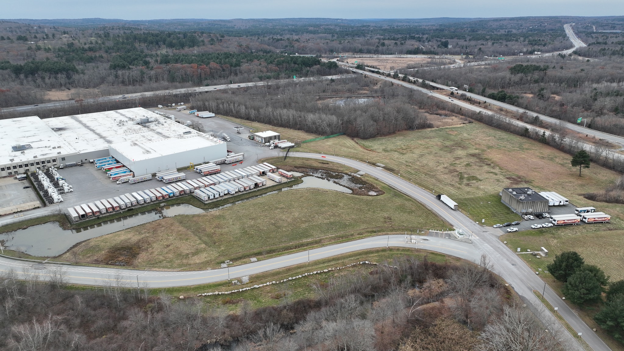 Drone photography recently showed the Cumberland Farms/EG Group facility at 165 Flanders Road in Westborough. EG, which acquired Cumberland Farms in 2019,is looking to expand the parking lot at its Westborough facility. (Photo/Tami White)