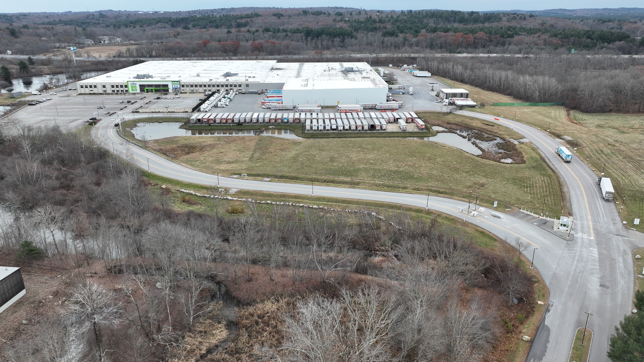 Drone photography recently showed the Cumberland Farms/EG Group facility at 165 Flanders Road in Westborough. EG, which acquired Cumberland Farms in 2019,is looking to expand the parking lot at its Westborough facility. (Photo/Tami White)