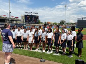 St. Mary School students sing National Anthem before WooSox game