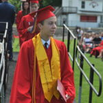 H Valedictorian Charles Togneri walks after receiving diploma