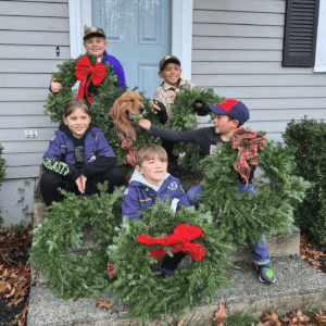 Cub Scouts staging holiday wreath sale