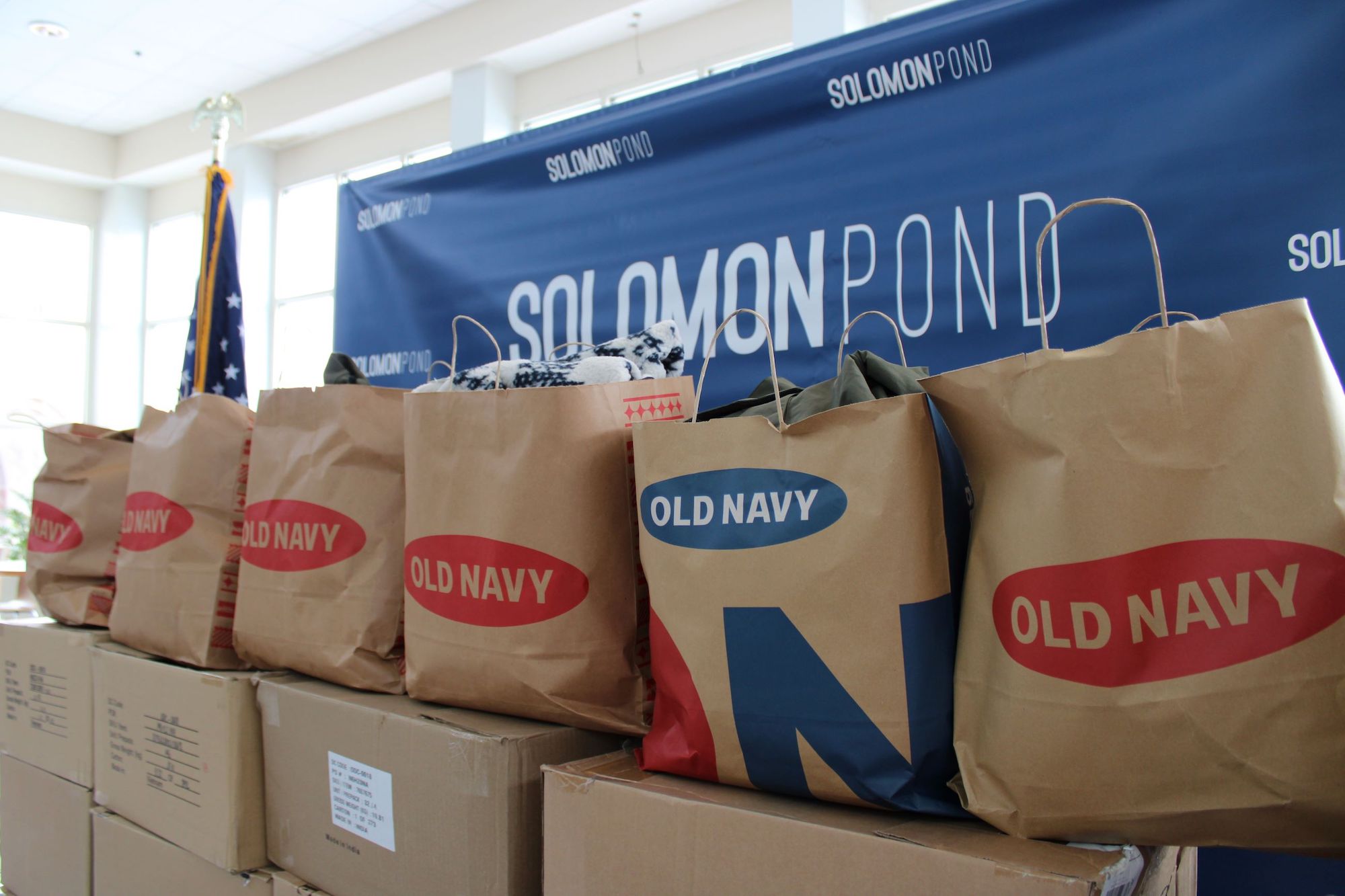 Solomon Pond Mall donates winter clothing