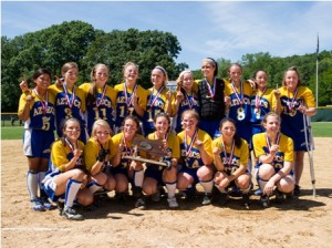 The Assabet Valley Regional Technical High School softball team poses with their first-ever state title trophy.