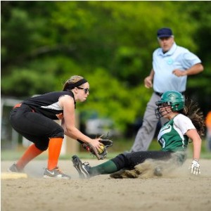 Marlborough High School shortstop Victoria Falco (#4, left) waits to apply the tag to Wachusett RegionalHigh School's  Emily Gigliotti (#10, right).  Gilgiotti was safe on the play.