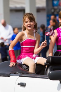 A young girl enjoys riding in the parade.   Photo/Jeff Slovin 