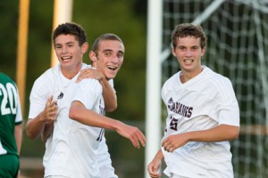 Algonquin senior Domenic Cianci (center) celebrates with Nolan Kissinger (left) and Max Michaud (right) after scoring the go- ahead goal in a game against Wachusett. 