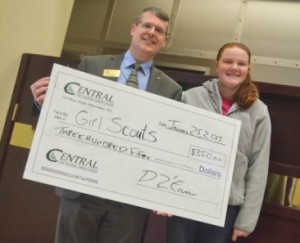 Girl Scout senior Kaleigh Wright accepts a check for the March 23 PS6 foam collection day from Central One Federal Credit Union manager Dave Kaiser. What began as a Girl Scout Silver Award project has turned into a community-wide effort to help the environment. Wright and Bhargavi Ram raised close to $2,000 to ensure their foam recycling partner, ReFoamIt, would be able to collect foam in Westborough twice a year for five years. Photo/Submitted