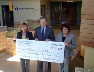 (l to r) Ellen Dorian, executive vice president, marketing and HR, and Rick Bennett, president and CEO, of Marlborough Savings Bank present the check to Candra Szymanski, interim president and CEO, Marlborough Hospital    Photo/submitted 