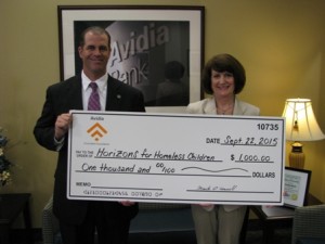 Keith Dwinells, manager of Avidia Bank’s main branch in Hudson, presents a check to Katherine Carroll Day, senior development officer, Corporate and Foundation Relations of Horizons for Homeless Children. Photo/submitted 