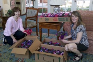 Lynn Ishak, social services, and Lisa Kubiak, executive director, of the Mary Ann Morse Nursing and Rehabilitation Center, pose with the flowers donated by Home Instead. 