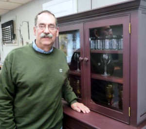 Rand Bardsley with a hutch from Blackington Furniture Photo/Nancy Brumback 
