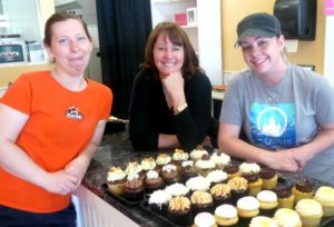 The CocoBeni Confections staff and some of their creations: (l to r) Rachel Cooke, Jennifer Shay and Jess Sutliff. Photo/Nancy Brumback 