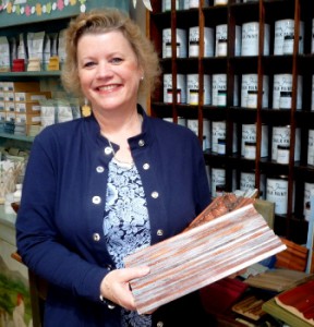 Maureen Bane, owner of Signature Finishes, with a paint sample Photo/ Nancy Brumback 