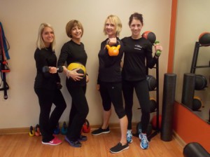 Get in Shape for Women's Westborough trainers (l to r) Casandra Kane, Andrea Longo, Pam Sarafin and Julie Vander Baan provide support and encouragement for clients.  File photo/Valerie Franchi