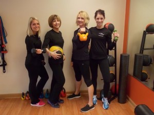 Get in Shape for Women's Westborough trainers (l to r) Casandra Kane, Andrea Longo, Pam Sarafin and Julie Vander Baan provide support and encouragement for clients. Photo/Valerie Franchi