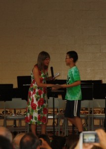 Bryant Li receives a certificate. Bryant was commended on near perfect attendance for the school year.  