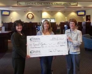 Nancy Pollack (center) stands with Central One Federal Credit Union's Joan Day (l), Shrewsbury branch manager, and April Healey, vice president of retail services, after winning the $5,000 Dream Vacation.  