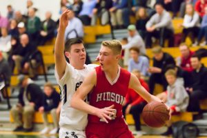 Hudson’s Tim Person is guarded by Grafton’s Sean Deely.