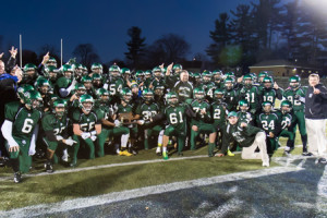 Grafton football players pose with their Central Mass Division 4 championship trophy. 