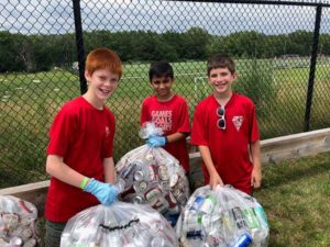 Scouts from Troop 107 sort donated bottles and cans during a summer bottle drive. Photo/Nick Frank.