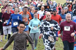 Runners begin the fourth annual Harvest Home 5K Race. Photos/Ed Karvoski Jr.
