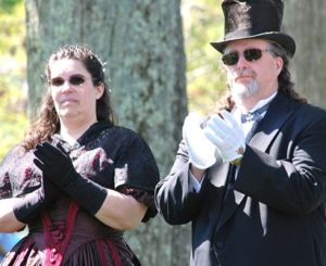 Christina and Stephen Qualey applaud during a rededication of the tercentenary marker.