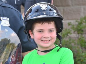 Ian Ouellette, 8, sports a motorcycle police officer helmet. 