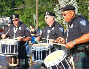 Performing for guests are members of the Police Pipes and Drums of Worcester.