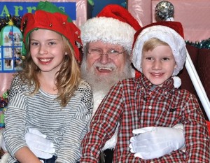 The Mussler siblings – Maggie, 10, and Sam, 7 – meet Santa Claus. Photo/Ed Karvoski Jr.