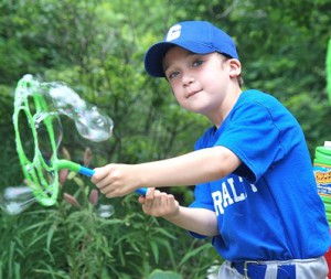Wayne Louis Guerad, 7, creates bubbles. 