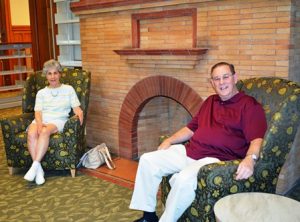 Longtime volunteers Judy and Dean Gillam admire the newly renovated small periodicals area of the historic library. 
