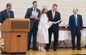 Graduate Sarah Purcell receives her diploma. 