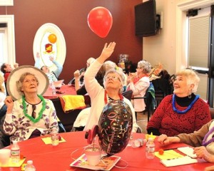 Playing a modified version of beach volleyball with a balloon are (l to r) Marilyn Zina, Claire Feehan and Judith Quinn.