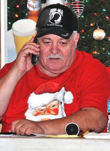 Commander Bill Rivers coordinates the deliveries from the Hudson AMVETS Post 208 last Christmas Day.
