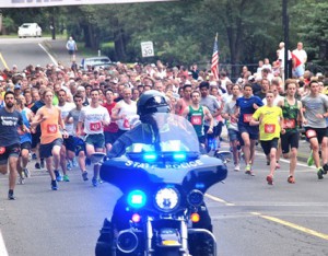A state police officer escorts the second annual Gov. Cellucci Tribute Road Race from the Hudson-Concord Elks Lodge 959. 