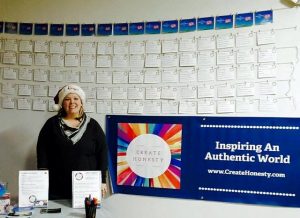 Michelle Mercier of Create Honesty displays gratitude lists at the 14th annual Hudson Downtown Holiday Stroll. Photo/submitted