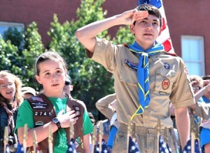 Leading the Pledge of Allegiance are Natalie Mollic of Girl Scout Troop 72741 and Johnny Petrovick of Boy Scout Troop 2.
