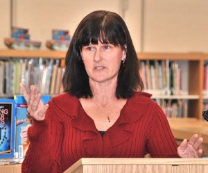Patty Cariveau speaks about her father, James Boyd, at a ceremony formally naming the Farley Elementary School library in his memory. (Photo/Ed Karvoski Jr.)
