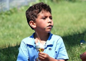 Gabriel Santos, 5, completes his ice cream treat before it melts.