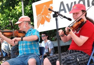 The Fiddling Thomsons perform at the Avidia Stage, sponsored by Avidia Bank.