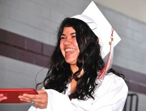 Louisa Contreras happily receives her diploma.