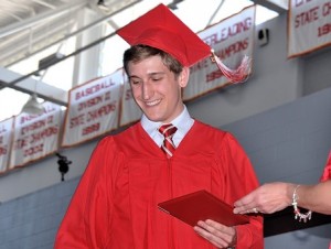 Mike Goodwin exits the platform with diploma in hand.