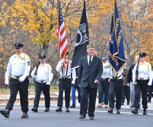 The Color Guard of AMVETS Post 208 leads the parade. 