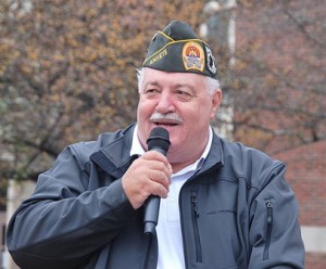 Past Commander Bill Rivers of AMVETS Post 208 speaks as the grand marshal at Liberty Park. 