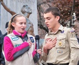 Leading the Pledge of Allegiance are Sydney Kerivan, 12, of Girl Scout Troop 72744, and Andrew Brandt, 15, of Boy Scout Troop 2. 