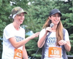 Paul and Jan Cellucci's daughters, Kate Garnett Cellucci and Anne Cellucci Adams, welcome race participants.